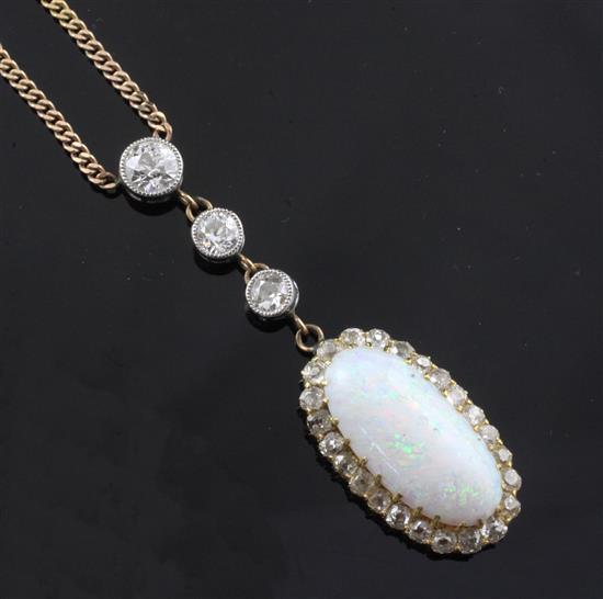 A gold, white opal and diamond drop pendant on a 9ct gold curb link chain, pendant drop approx. 2in.